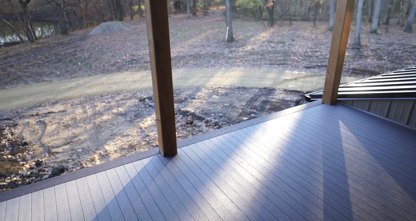 Beautifully finished deck with proper sealing in wooded setting