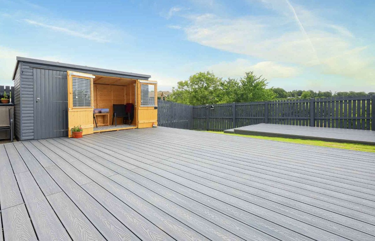Spacious composite deck installation showcasing quality materials in Salinas backyard